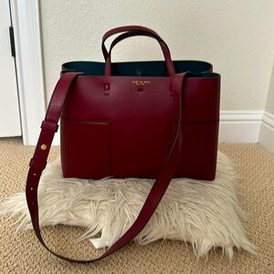 Burgundy Tory Burch tote with divider. Can fit a small laptop.